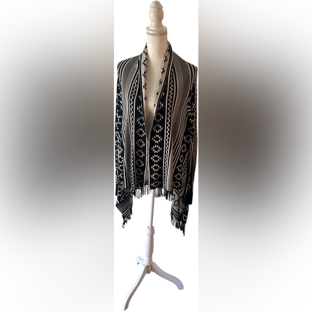 Madison Black and Cream Patterned Poncho sweater.